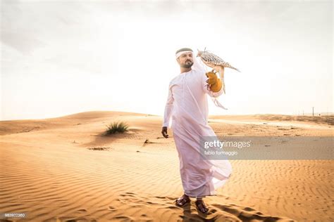 Arabic Man In The Desert With His Hawk High Res Stock Photo Getty Images