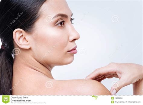 Side View Of Pretty Dark Haired Young Woman Stock Image