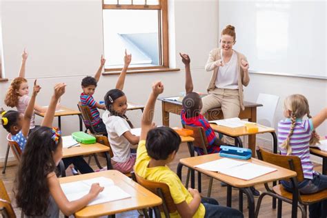Pupils Raising Hand In Classroom Stock Photo Image Of Answering