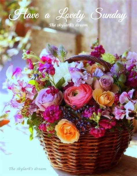 A Basket Filled With Lots Of Flowers On Top Of A Table