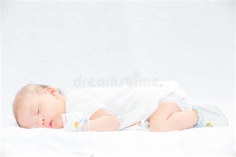Peaceful Baby Lying On A Bed While Sleeping Stock Image Image Of
