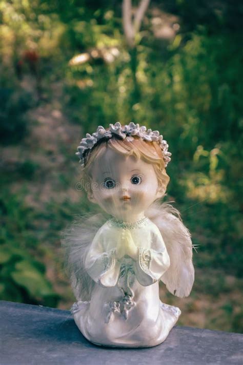Cute Praying Angel On The Window At Home Religious Background Stock