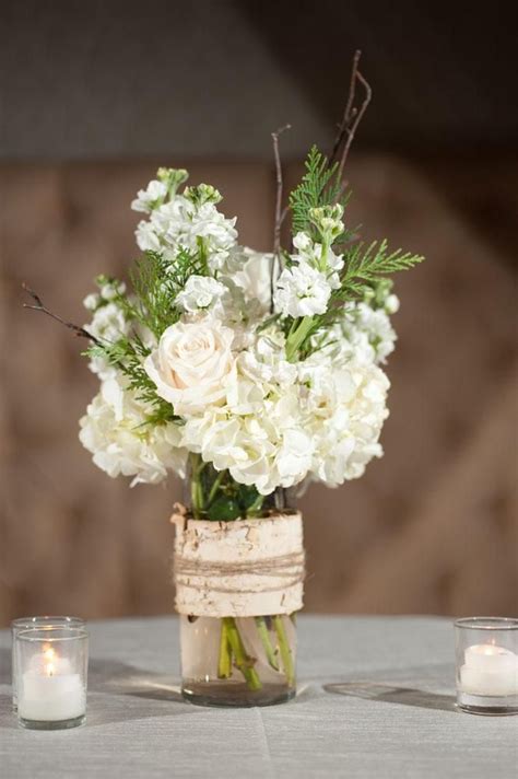 If it's a fancy outdoor gathering, classy rope lighting and simple floral centerpieces are in order. Simple Table Decorations For Rehearsal Dinner Photograph | r