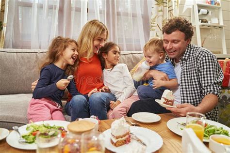 Happy Parents Hugging Their Children And Smiling Stock Photo Image Of