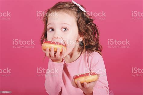 Cute Baby Girl Eating Donuts Stock Photo Download Image Now Baby