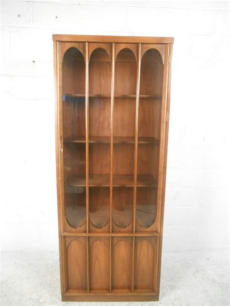 A corner curio cabinet is a perfect place to put your collectibles so they're safely out of reach but can still be appreciated from a distance. Mid-Century Modern Broyhill Brasilia Curio Display Cabinet ...