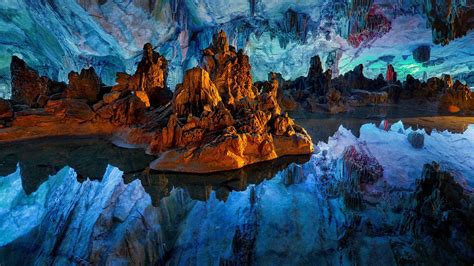 Reflections In Still Water Inside The Reed Flute Cave Guilin China