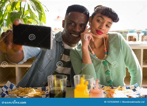 Couple Taking Selfie While Having Food Stock Image Image Of Indoors