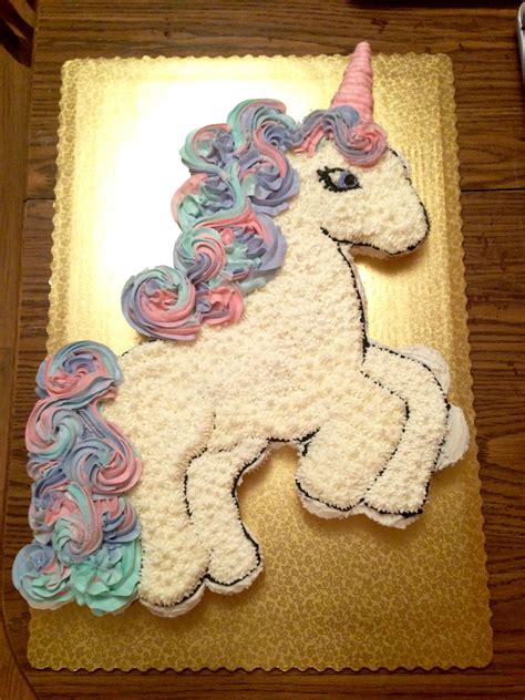 Here golden spiral candles make it an extra special event. Unicorn cupcake cake! Used about 40 cupcakes in both ...