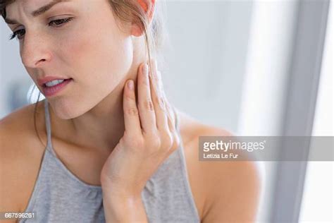 Rubbing Neck Photos And Premium High Res Pictures Getty Images