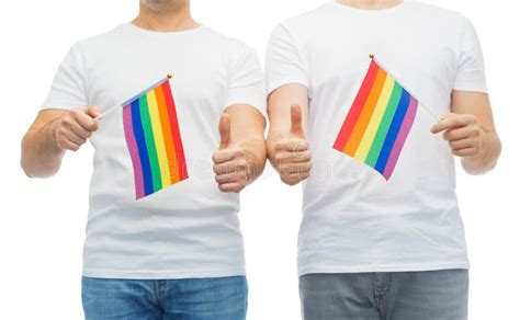 male couple with gay pride flags showing thumbs up stock image image of freedom pride 116381749