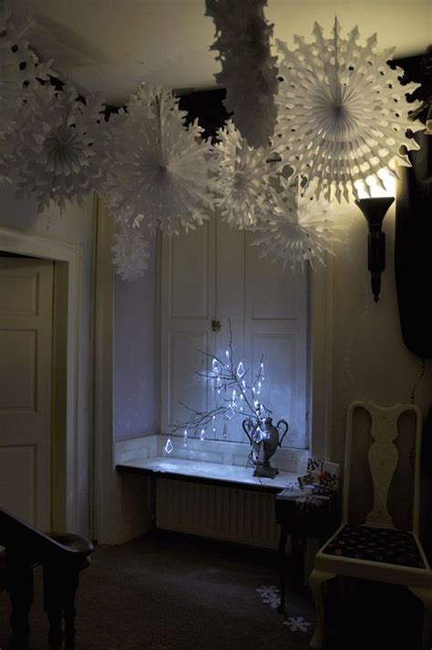 Assembling your snowflake wall hanging. Snowflakes hanging from the ceiling and beautifully lit ...