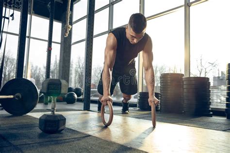 The Male Athlete Training Hard In The Gym Fitness And Healthy Life