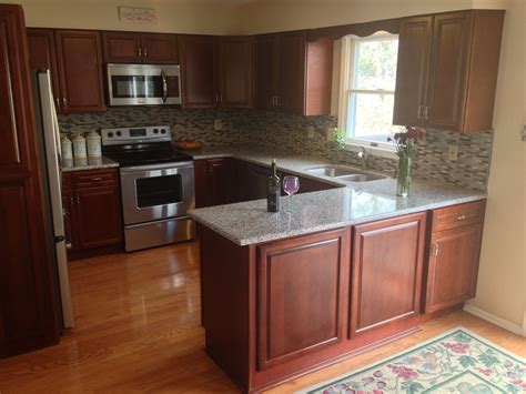 Removing and cleaning all of the items and throwing out expired or leaking products will also keep the interior of the cherry wood cabinets in good. Light granite on Cherry Cabinets with wood floor | Kitchen ...