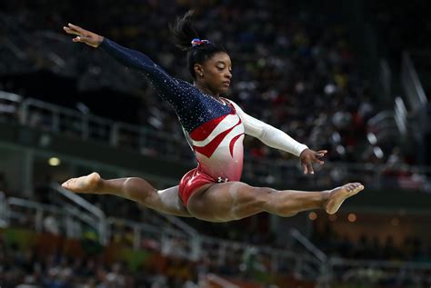 Simone biles demonstrated her abilities as a. Simone Biles Wins Handstand Challenge By Taking Off Trousers With Her Feet - UNILAD