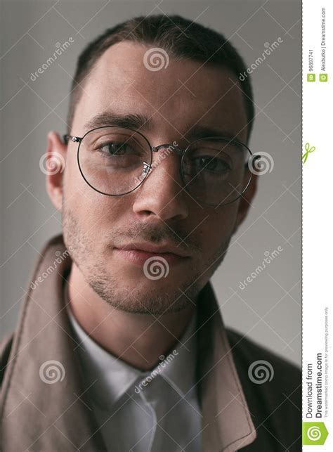 A Lonely Handsome Guy In A Raincoat And Glasses With Different Moods