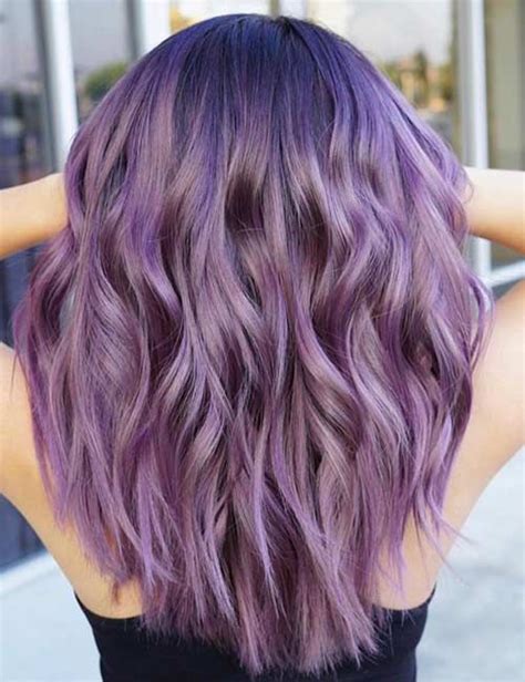 A soft lilac hue presents a calm charm to a straight hair balayage with an ash blonde base. Lilac Hair Color Looks