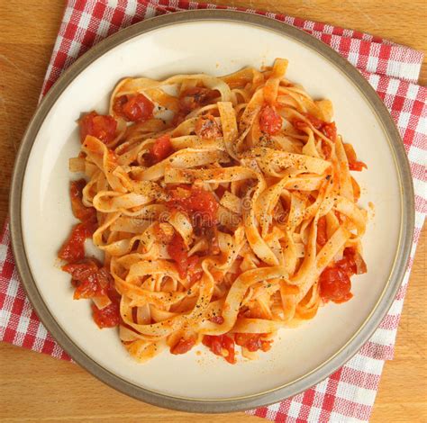 Tagliatelle Pasta with Tomato Sauce Stock Photo - Image of napkin ...