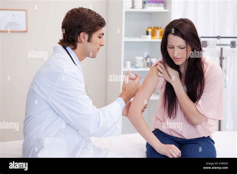 Male Doctor Giving Patient An Injection Stock Photo Alamy