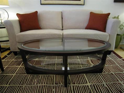 Glass furniture can be both visually stunning and practical. 30 Collection of Oval Glass and Wood Coffee Tables