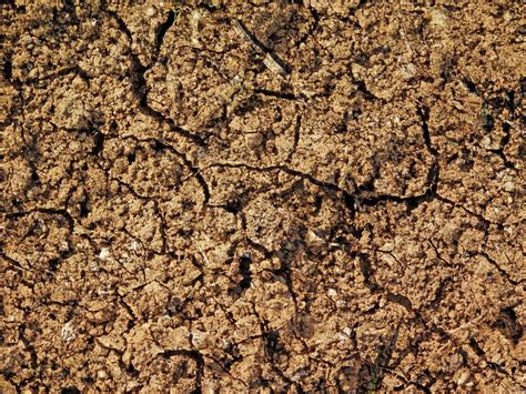 Patch Of Dry And Cracked Soil For Background Or Texture 2054332 Stock