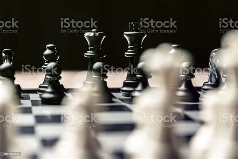 Chess Board With Black And White Chess Facing Each Other Stock Photo