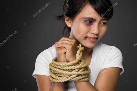 Woman With Hands Tied Up With Rope Being Abused Stock Photo By ©odua