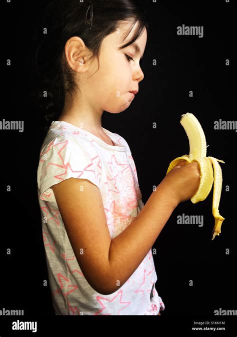 A Girl Eating Banana Hi Res Stock Photography And Images Alamy