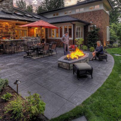 The rustic theme of this paver and pea gravel patio is complemented by the warm earthy color of the stones used. Guide: Weighing Down an Offset Cantilever Umbrella ...