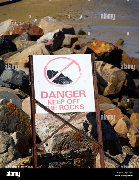 A Danger Sign Warning People To Stay Of Rocks Stock Photo Alamy