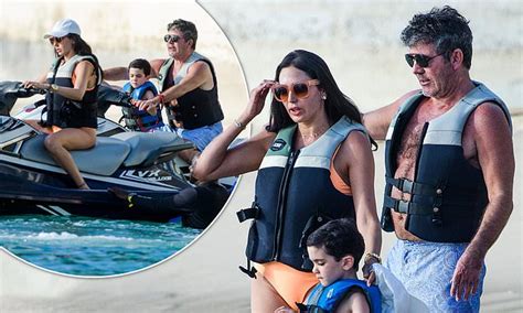 simon cowell 59 goes jet skiing with girlfriend lauren silverman and son eric in barbados