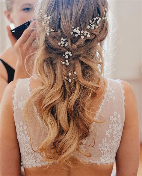 The rest of the beige, blonde waves should cascade your shoulders secure the braid with a hair tie and finish with the application of pomade to the ends, to get that wispy look. 33 Half Up Half Down Wedding Hairstyles to Try Koees Blog