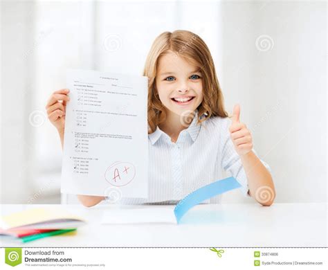 Girl With Test And Grade At School Royalty Free Stock