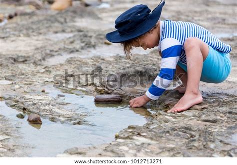 Child Discovering Outdoors Through Play Stock Photo Edit Now 1012713271