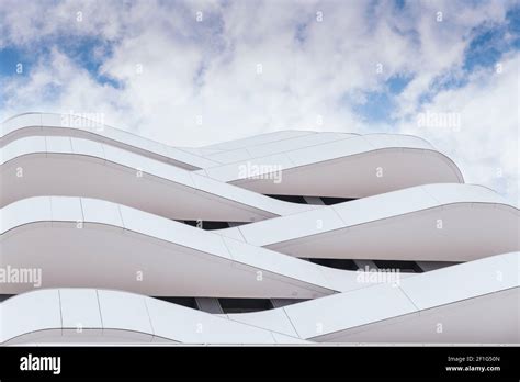 Modern Architecture Of A Building With Curves And Straight Lines