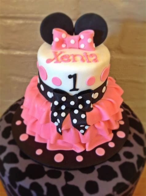 A Minnie Mouse Birthday Cake With Polka Dots