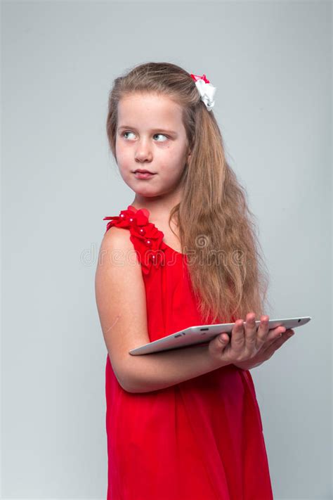 Girl In Red Dress Holding Digital Tablet Stock Image Image Of