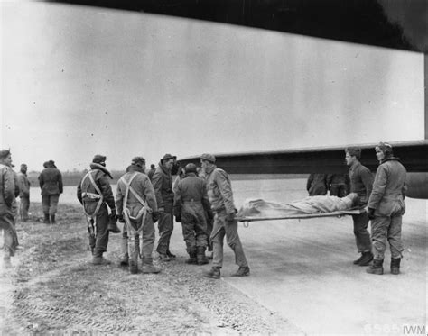 Asisbiz Usaaf 8af 401bg Medical Personnel Carry An Dead Airmen From A B