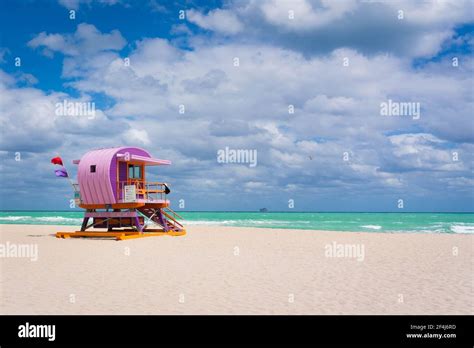 Sunny coastal beach with colorful life guard tower at bSouth Beach