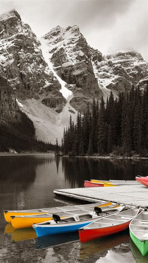 Moraine Lake And Boats With Snow Capped Mountain Banff