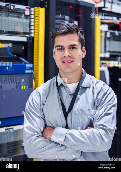 Hispanic Technician Smiling In Server Room Stock Photo Alamy