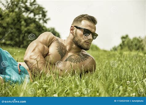 Handsome Muscular Shirtless Hunk Man Outdoor In City Park Stock Photo