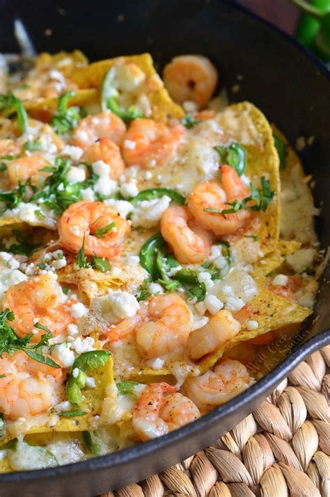these cheesy spicy shrimp nachos will make a great snack for everyone the nachos are loaded