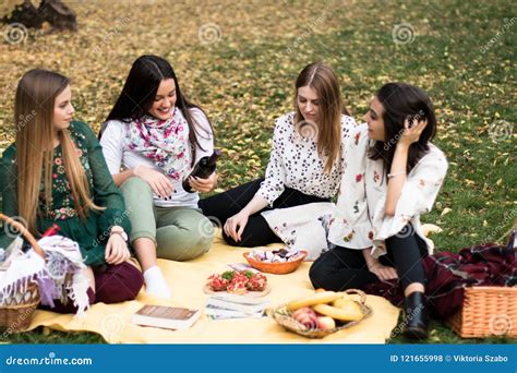 Group Of Young Women Having A Picnic In The Park Stock Photo Image Of