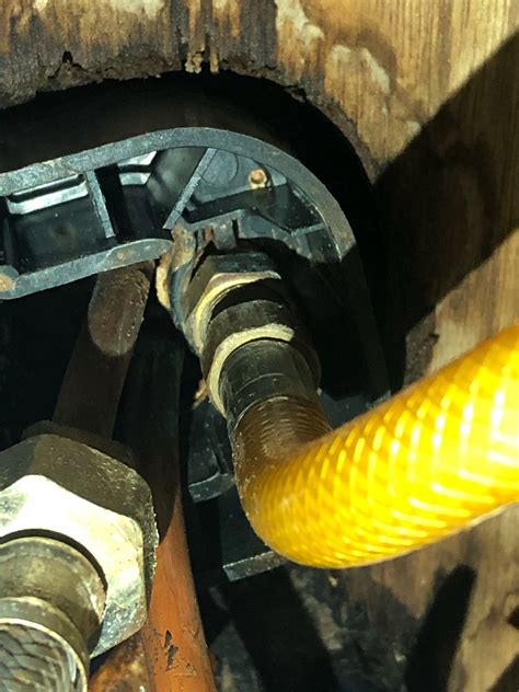 How do you fix a loose kitchen faucet? faucet - how to tighten the nuts inside the U shape under ...