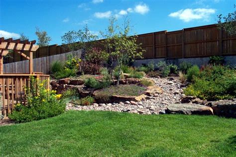 A backyard is an extension of what's going on inside your home. Sloping garden ideas photos | Hawk Haven