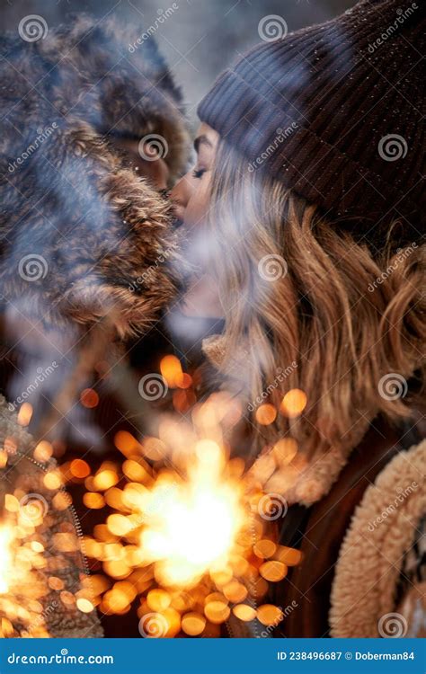 Couple Love Story In Snow Forest Kissing And Holding Sparklers Couple In Winter Nature Couple