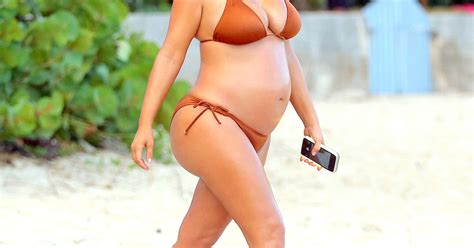 Pregnant Kim Kardashian Bares Her Bump In Bronze String Bikini Photos