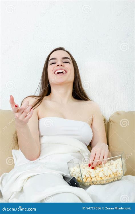 Girl Watching Movie Or Tv Laughing Having Fun Eating Popcorn Stock
