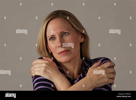 Attractive Middle Aged Woman Hugging Herself And Smiling Usa Stock Photo Alamy